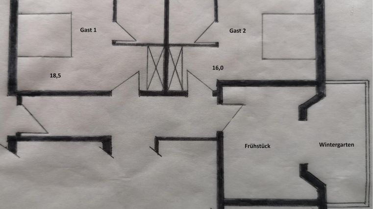 A floor plan of a room with two guest rooms, a breakfast area, and a conservatory. The dimensions are also indicated.